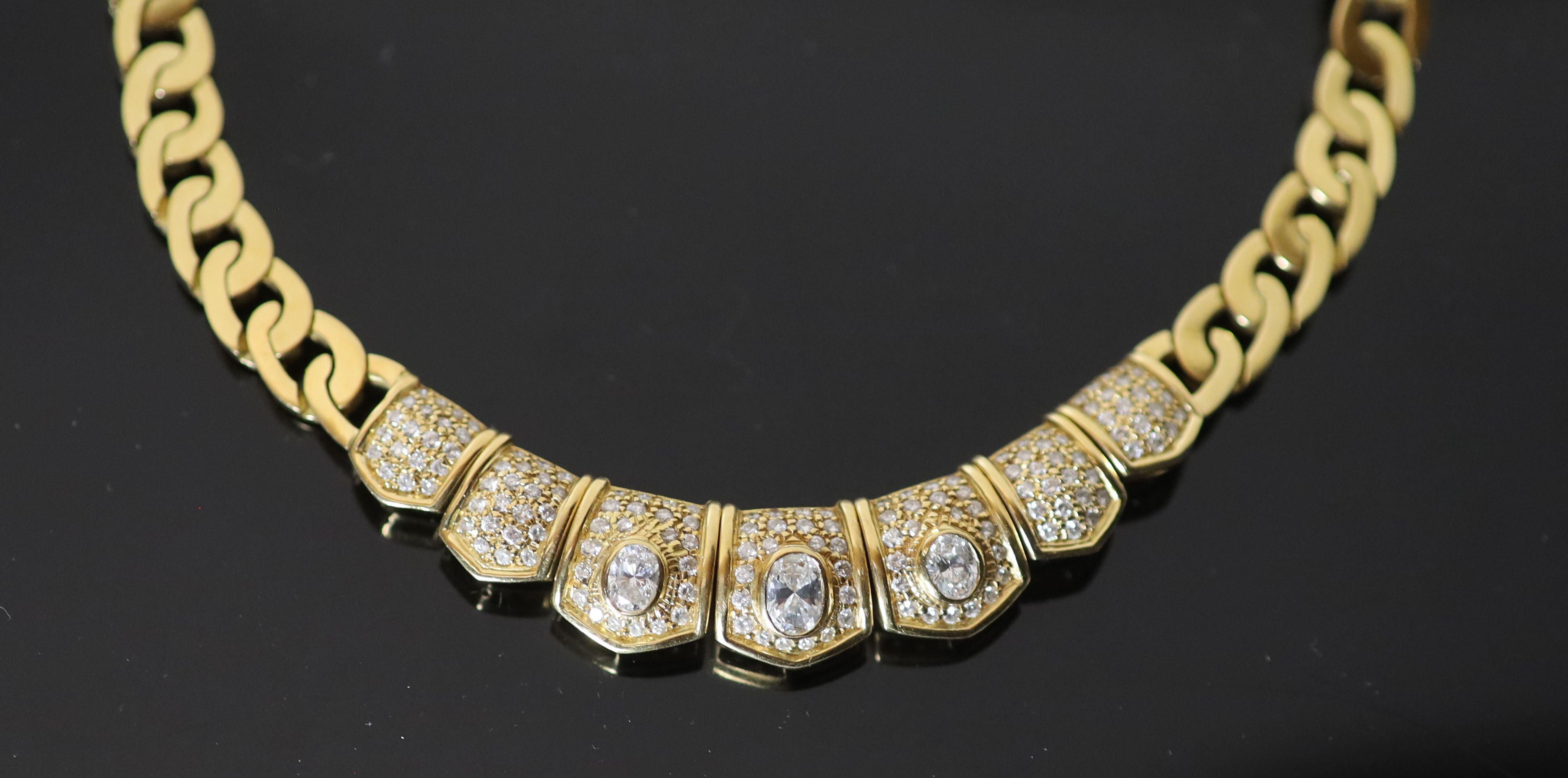 A modern Middle Eastern (possibly Egyptian) gold and diamond set oval curblink necklace,